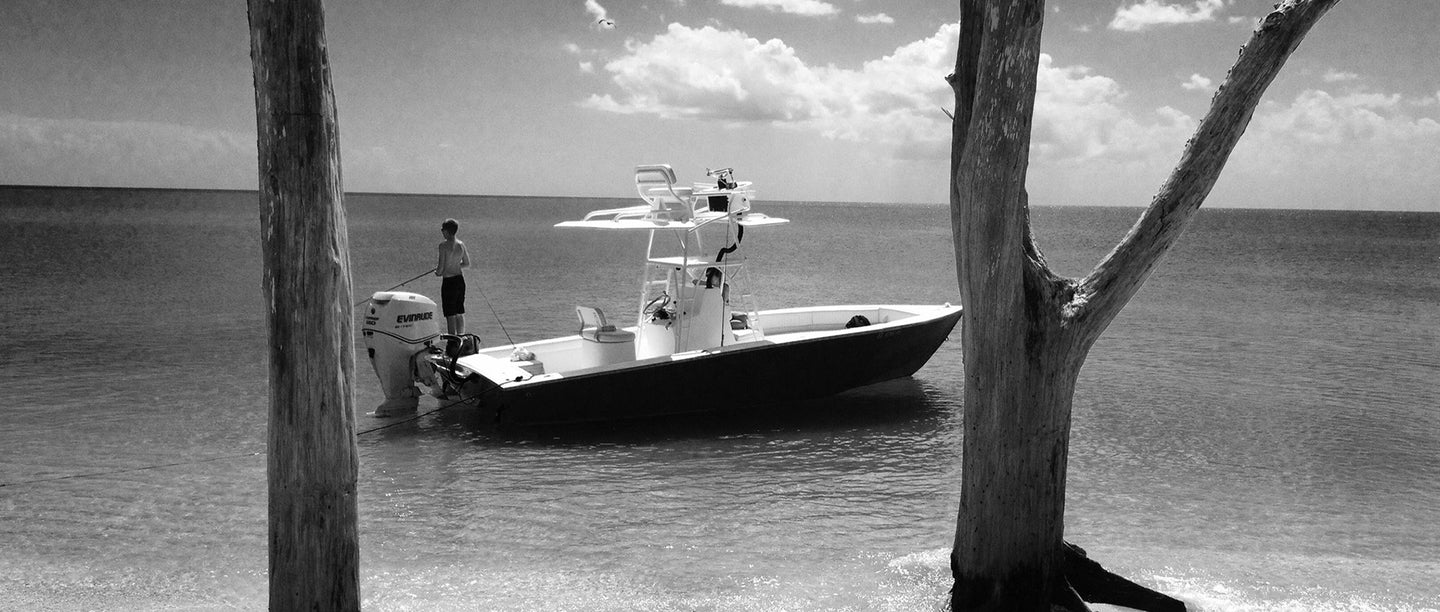 Kid fishing in a boat